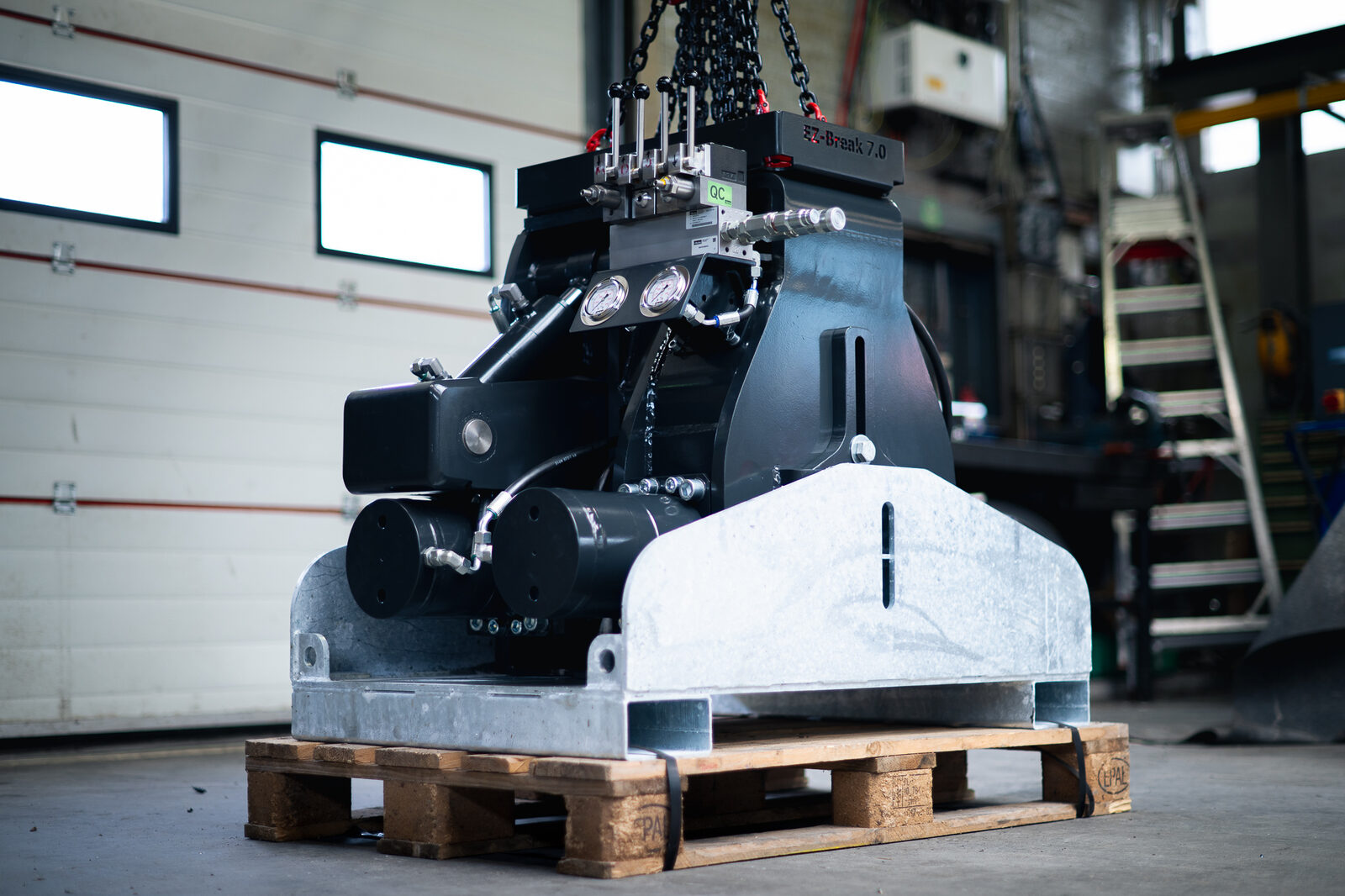 The machine being handled in the workshop.